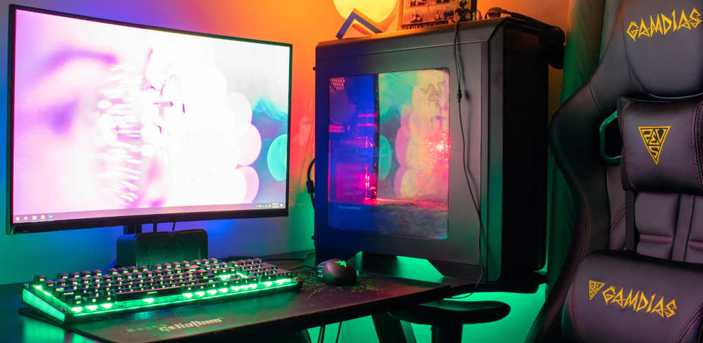 a brightly lit gaming PC and chair