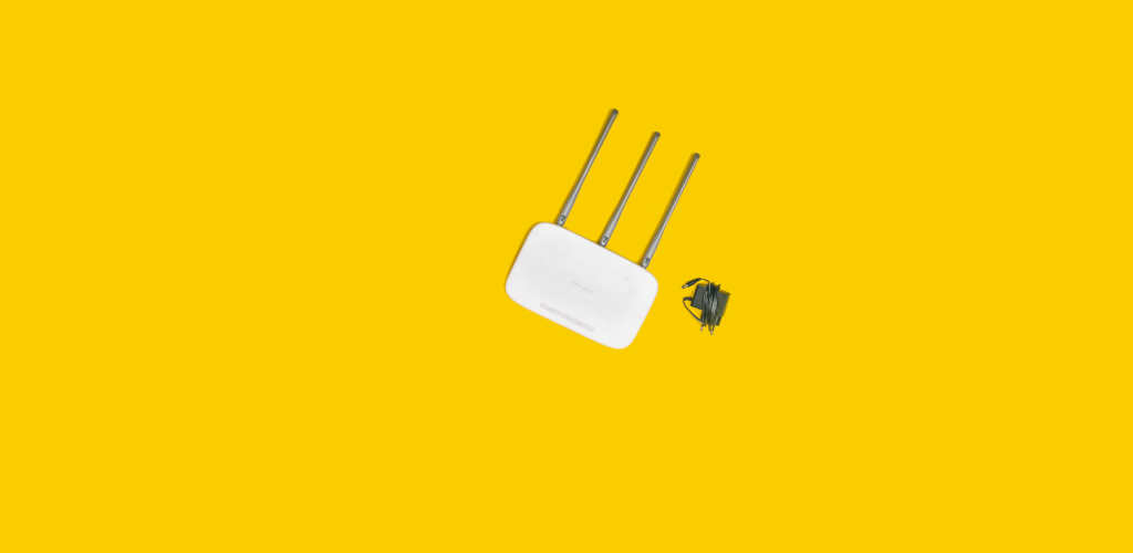 a wireless router on a yellow background