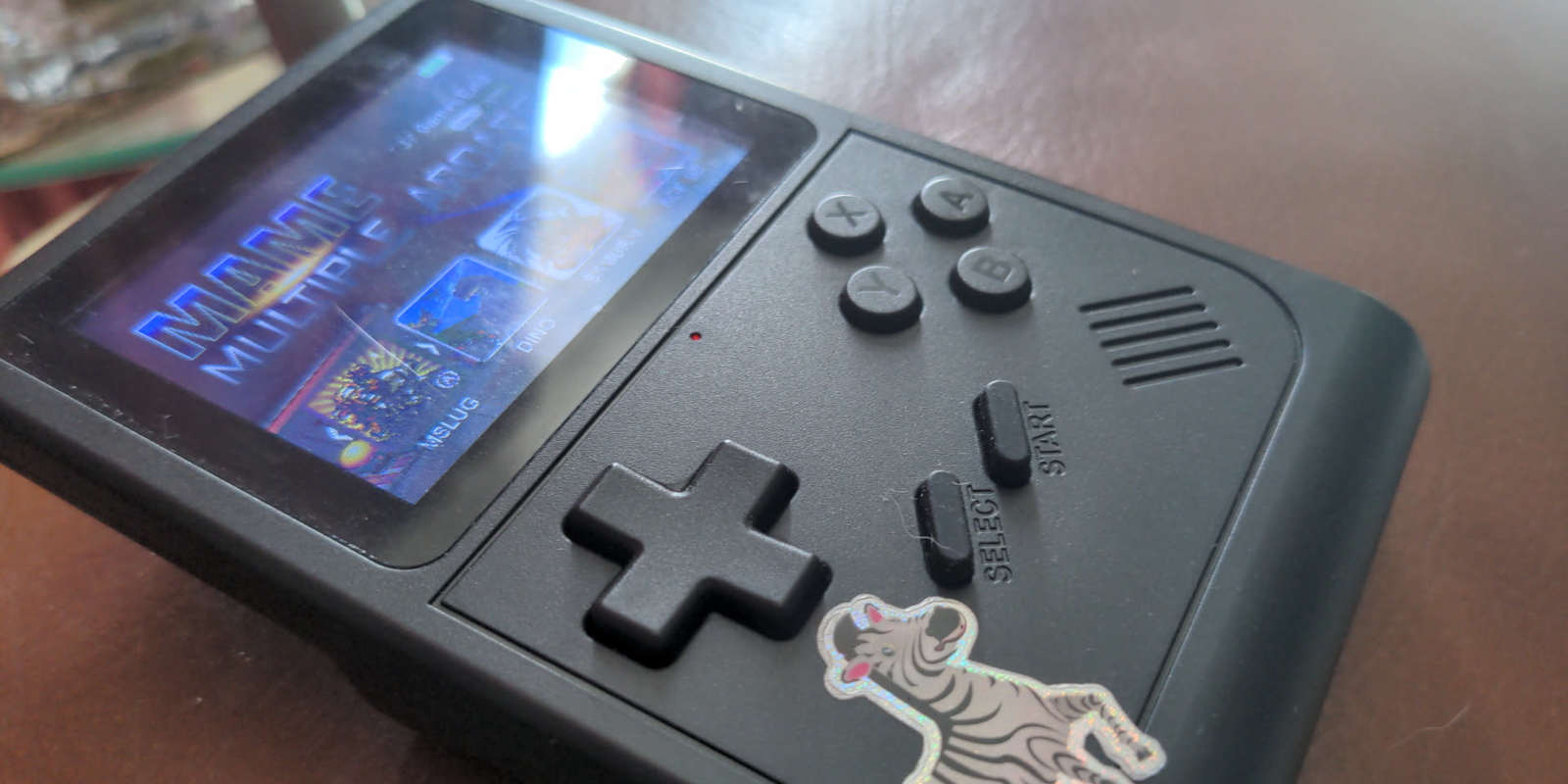 Damacoola Gamebox 300 with a zebra sticker, showing MAME screen. 