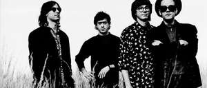 Band members of REM in black and white