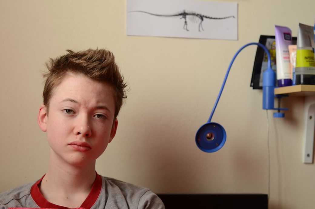 A tired-looking teenager