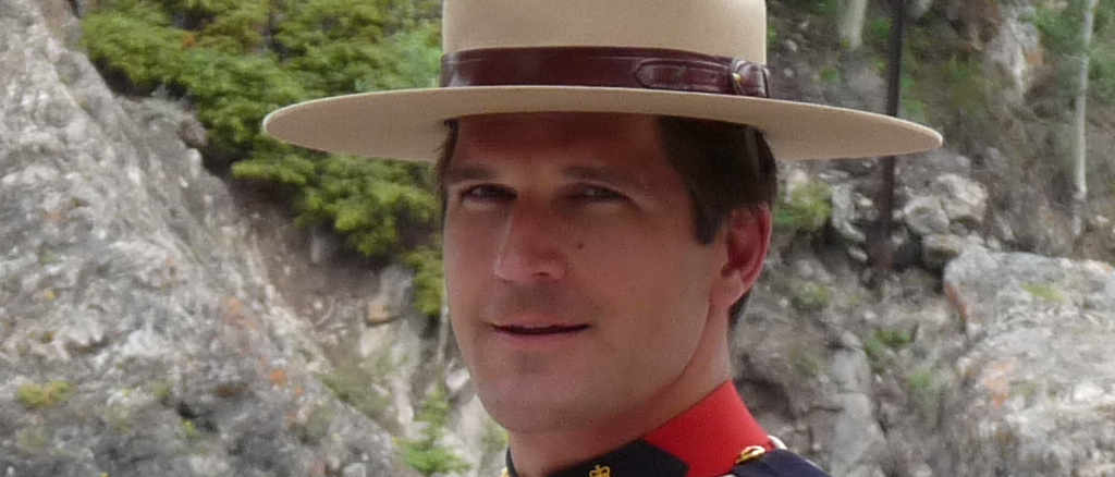 Headshot of a Mountie looking at the viewer
