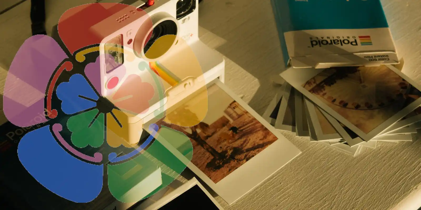 A Polaroid camera with some photos overlaid with the Immich logo