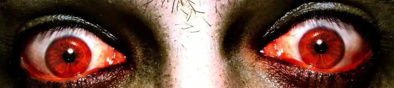 scary eyes with red pupils