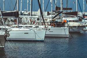Sailing yachts tied at a dock