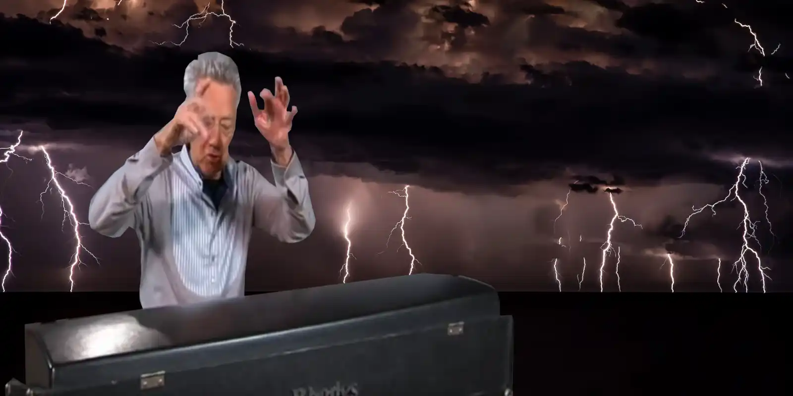 Ray Mazarek playing the organ against a lightning background