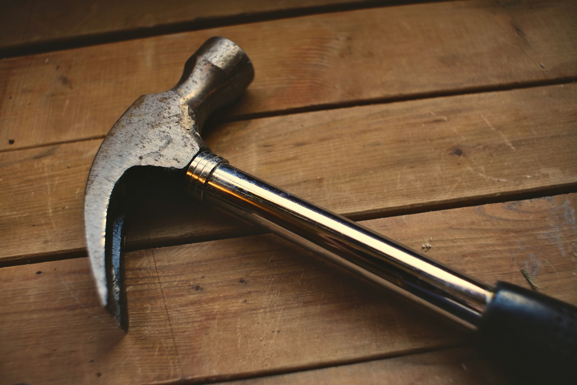 A hammer lying on wood