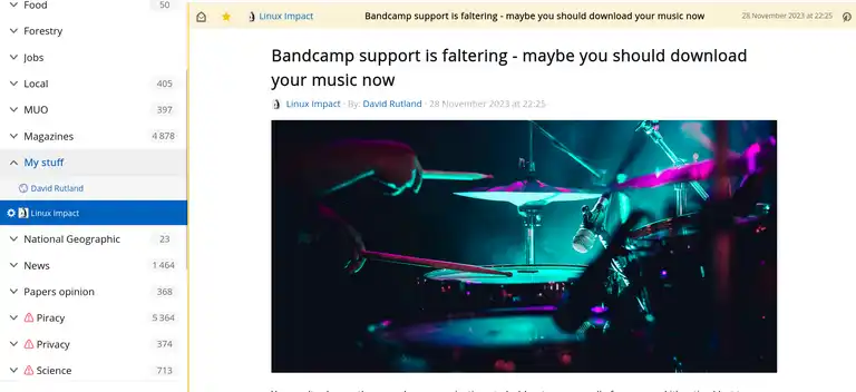 FreshRSS web interface there is a story open, and a picture of a drummer