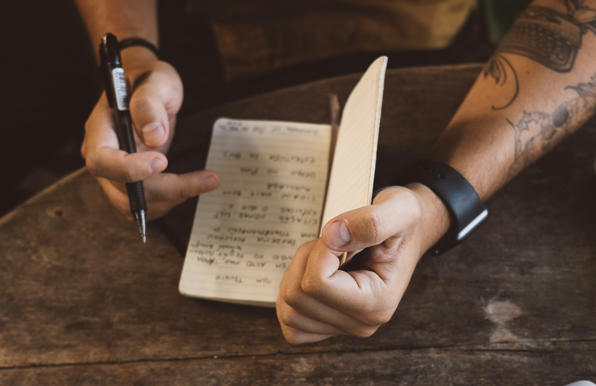 POV of a person wring in a notebook